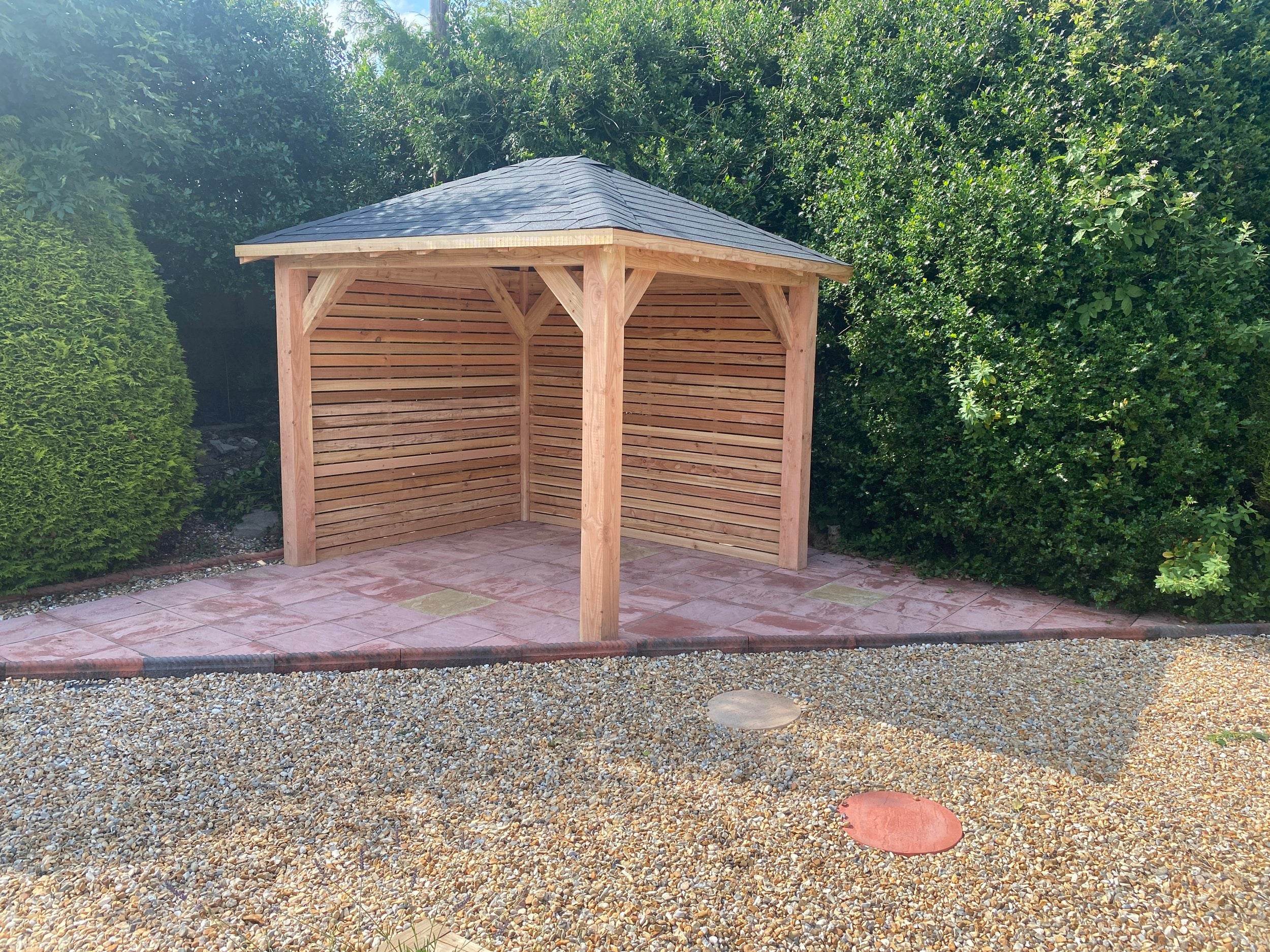 A custom size 3m X 2.5m forester larch gazebo with black shingles and hit and miss cladding as a DIY kit