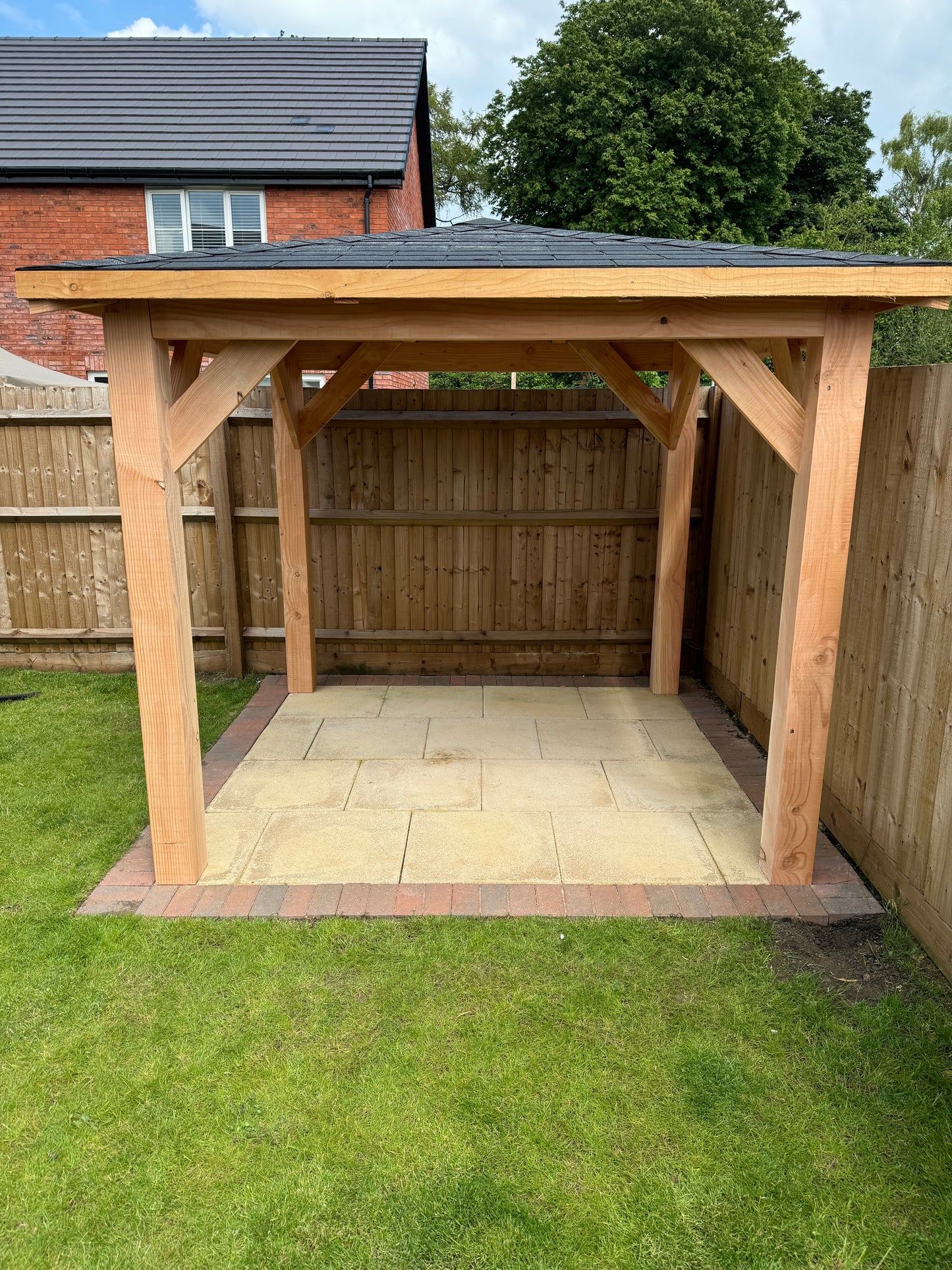 2.5m sq. Wooden gazebo structure on a grassy area with a house in the background